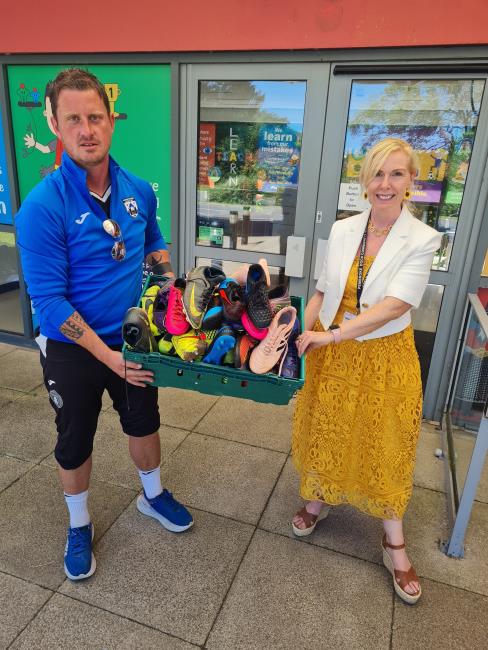 Pictured are James Devonald, Goalkeeping Coach at Haverfordwest County AFC and Michele Thomas, Headteacher of Pembroke Dock Community School.  